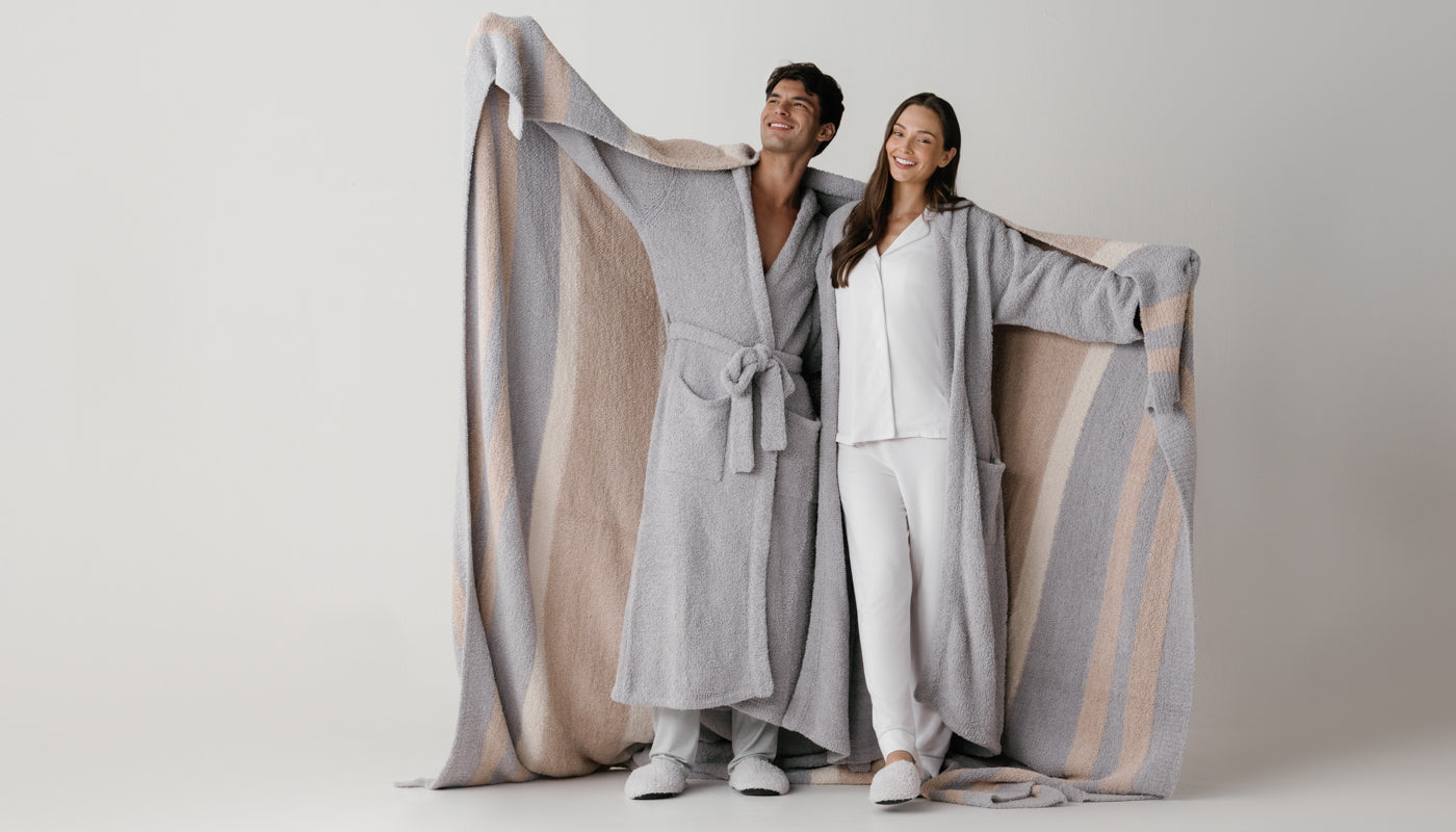 Two models wrapped in plush Kashwére robes and throws
